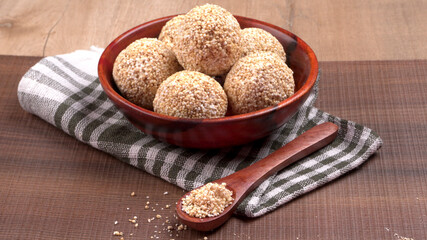 Amarnath seed, Cholai or Rajgira laddo, Also in cube shape called chikki or cake form, Indian sweet and healthy food served in a plate and bowl. Selective focus.