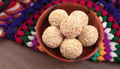 Amarnath seed, Cholai or Rajgira laddo, Also in cube shape called chikki or cake form, Indian sweet and healthy food served in a plate and bowl. Selective focus.