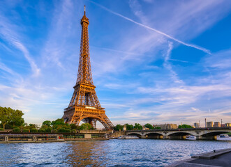 Paris Eiffel Tower and river Seine at sunset in Paris, France. Eiffel Tower is one of the most iconic landmarks of Paris