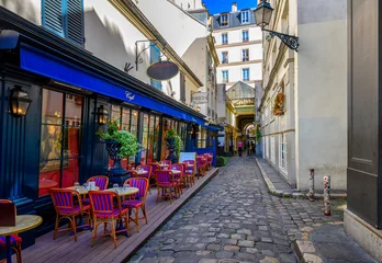 Foto auf Acrylglas Narrow street with tables of cafe in Paris, France. Cozy cityscape of Paris. Architecture and landmarks of Paris. © Ekaterina Belova