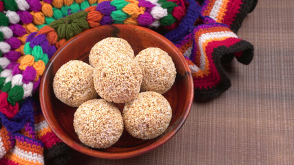 Amarnath seed, Cholai or Rajgira laddo, Also in cube shape called chikki or cake form, Indian sweet and healthy food served in a plate and bowl. Selective focus.