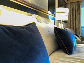 View into luxurious oceanview outside exterior porthole window luxury suite category bedroom with...