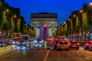 Champs-Elysees and Arc de Triomphe at night in Paris, France. Architecture and landmarks of Paris....