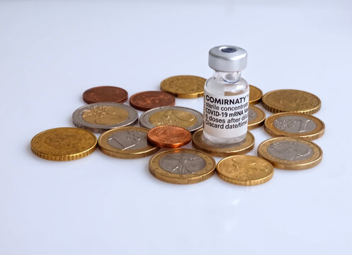 Isolated Comirnaty Biontech vaccination ampoule against Covid-19 or Corona virus with Euro money coins
