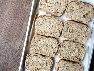 Sliced multigrain bread in baking tray