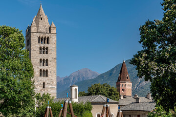 Fototapeta na wymiar View of the churches of San Lorenzo and Santi Pietro e Orso with their bell towers, historic center of Aosta, Italy