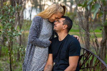 couple in intimate moment in bush park