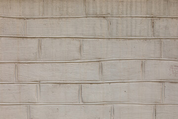 A crooked seam of a brick wall. Rustic brick texture.