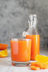 Orange and carrot juice or fruit smoothie. Healthy food, nutrition and diet concept.