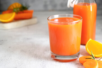 Orange and carrot juice or fruit smoothie. Healthy food, nutrition and diet concept.