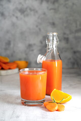 Orange and carrot juice or fruit smoothie. Healthy food, nutrition and diet concept.