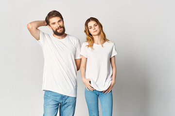 man and woman stand side by side in white t-shirts Copy Space mockup design
