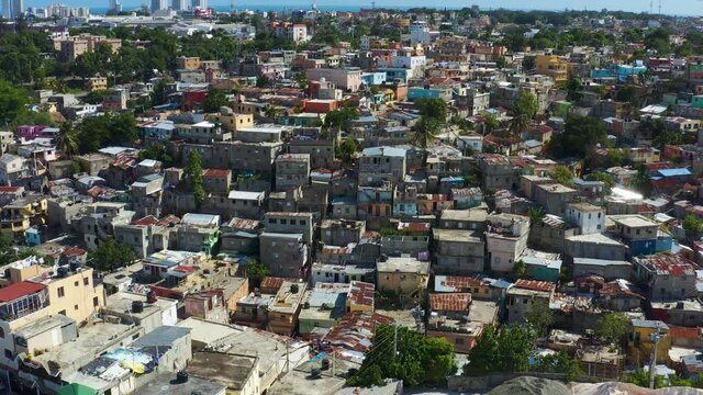 Slums of Santo Domingo Dominican Republic. Houses and streets of red and poor neighborhoods.