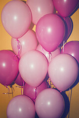 pink balloons on yellow background