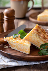 Slice of cheese quiche on a plate