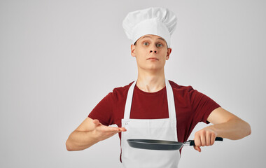 a man in a chef's uniform cooking work professionals