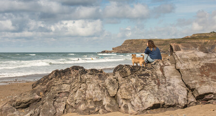 Black Rock Beach, Widemouth Bay in Bude Cornwall, Watching the Surfers