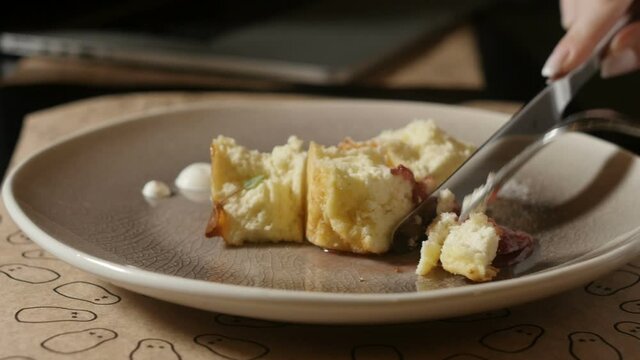 women's hands cut pie not white plate close-up shooting. Video for advertising cafes, restaurants, cooking courses. High quality FullHD footage