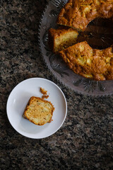 Homemade apple cake and a slice seen from above.