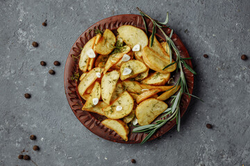 roasted rosemary garlic potato wedges on a plate