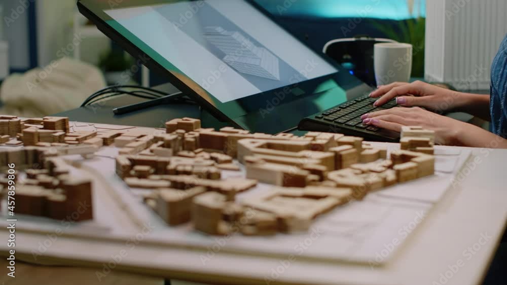 Aufkleber close up of building model on table and woman using touch screen, analyzing maquette on computer. ar