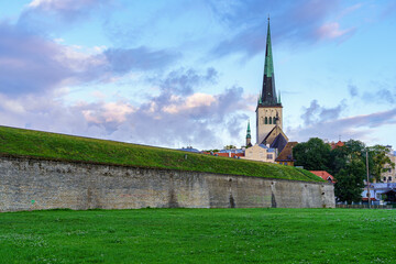 Medieval cathedral church next to stone wall in Tallinn Estonia.