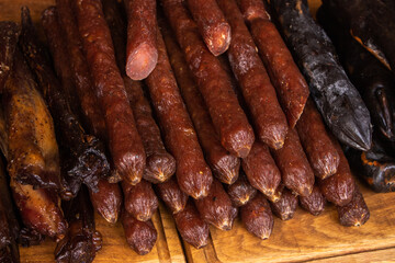Handmade smoked sausages on food market.