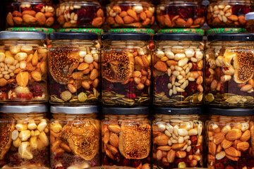 Nut sets. Canned nuts with honey in glass jars. Harvest of nuts. Delicacy and Healthy food. Homemade preservation in autumn.