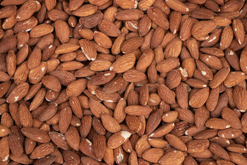 Organic almond nuts as background, top view. Healthy snack