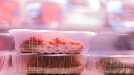 Meat products put up for sale in a supermarket commercial fridge
