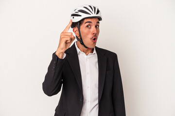 Young mixed race business man wearing a bike helmet isolated on white background having an idea, inspiration concept.