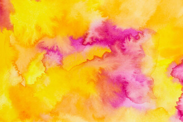 abstract watercolor background in shades of yellow, orange and pink