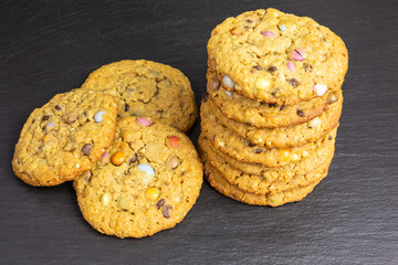 chocolate chip cookies with peanut butter, rolled oats and colorful chocolate candy