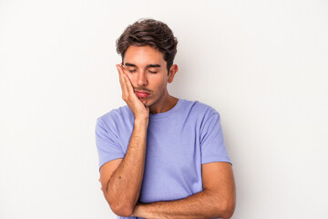 Young mixed race man isolated on white background who is bored, fatigued and need a relax day.