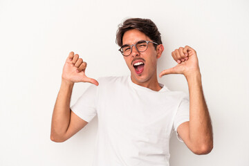 Young mixed race man isolated on white background feels proud and self confident, example to follow.