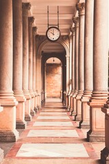 A view into the historical colonnade with clock above at spa city Karlovy Vary, Czech republic
