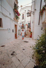 Man walking through the alleys of the historic center of Martina Franca