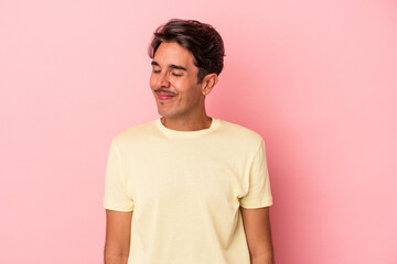 Young mixed race man isolated on white background laughs and closes eyes, feels relaxed and happy.