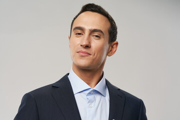 business man in shirt and jacket on gray background confident look portrait model
