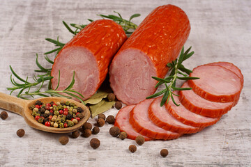 Sausage, cold cuts, and a composition with spices