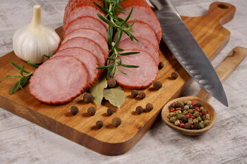 Sausage, cold cuts, and a composition with spices