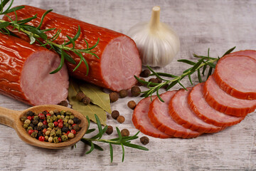 Sausage, cold cuts, and a composition with spices
