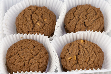 Delicious tasty snack of brown cookies with chocolate chip and peanut isolated on black background