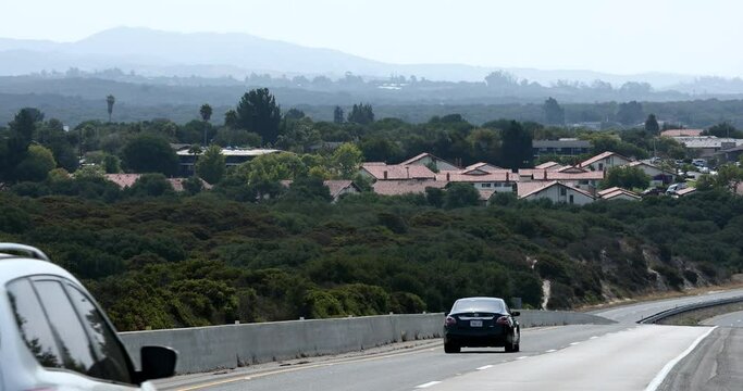 Traffic passes by the downtown area of Lompoc, California, USA.
