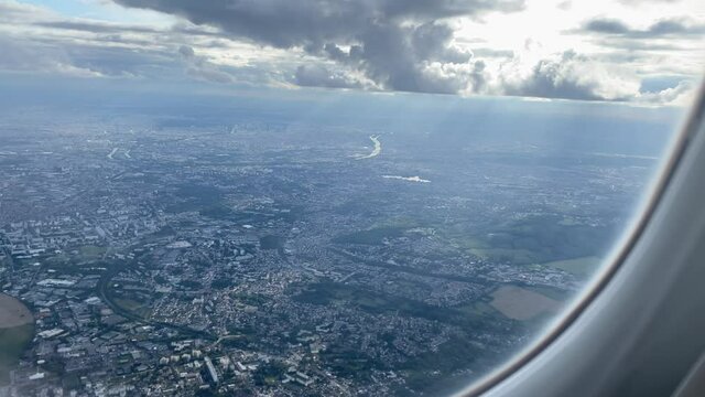 View from window of plane flying over Paris