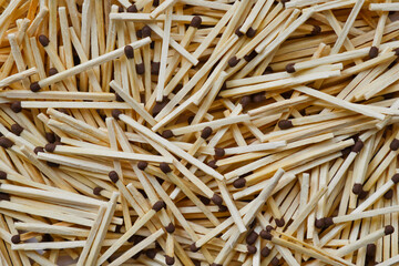 Lots of wooden matches texture. Abstract background of new wooden matches.