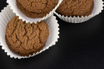 Delicious tasty snack of brown cookies with chocolate chip and peanut isolated on black background