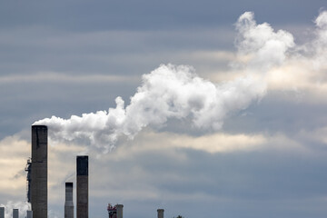 Chimneys emitting white water vapor in a chemical plant. Shot in Sweden, Scandinavia