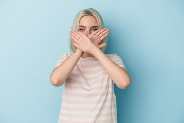 Young caucasian woman isolated on blue background doing a denial gesture