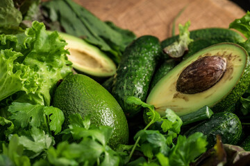 Vegetarian still life. Green fruits. Natural background. Avocado and other greens.